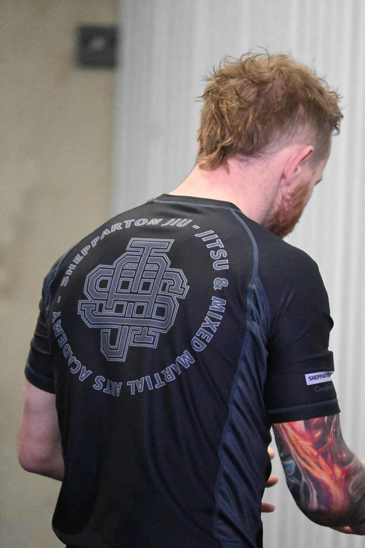 Member wearing the Shepparton Jiu-Jitsu academy rash guard